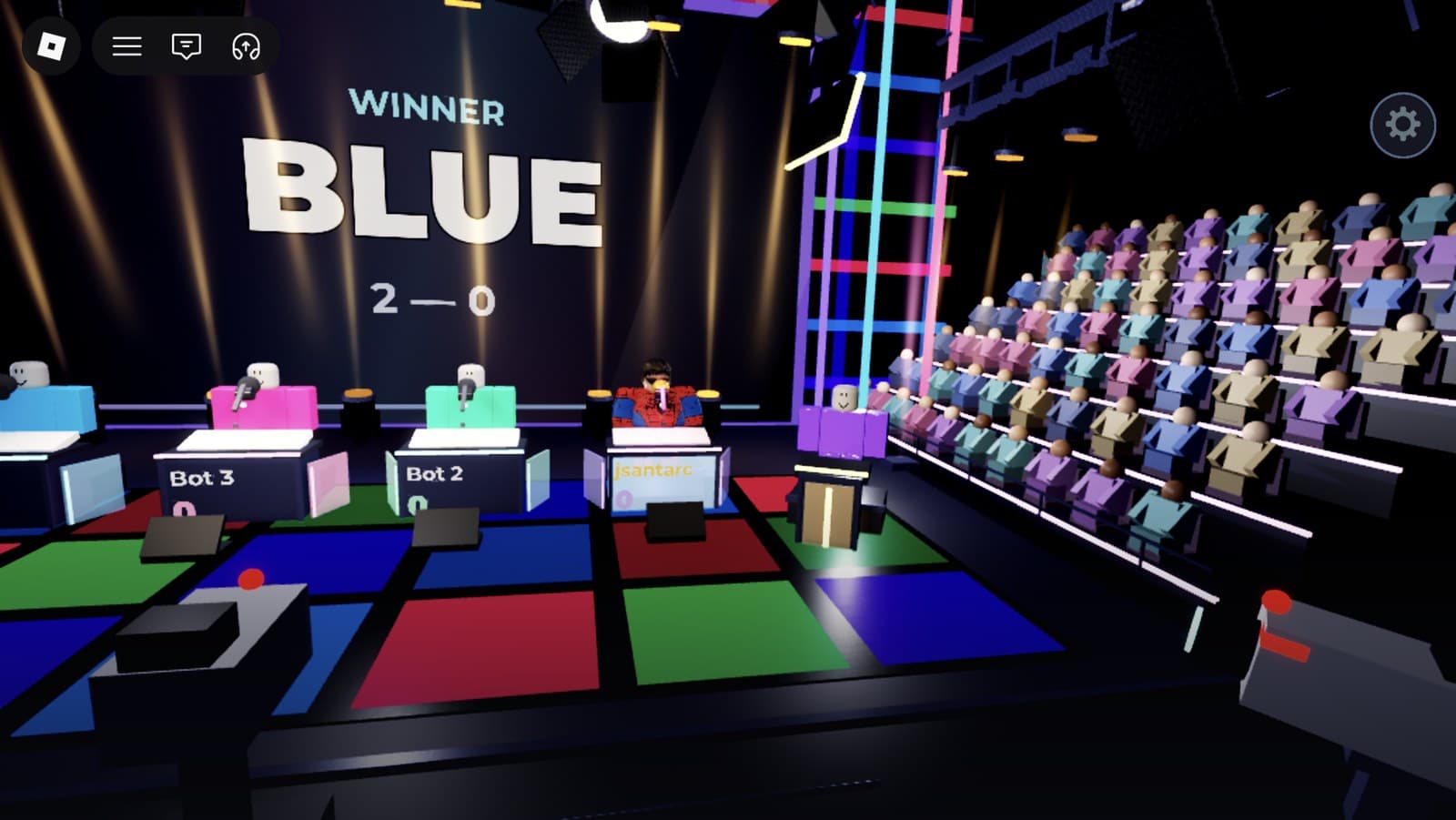 The video wall reading Winner, Blue, 2–0 under warm celebration lighting