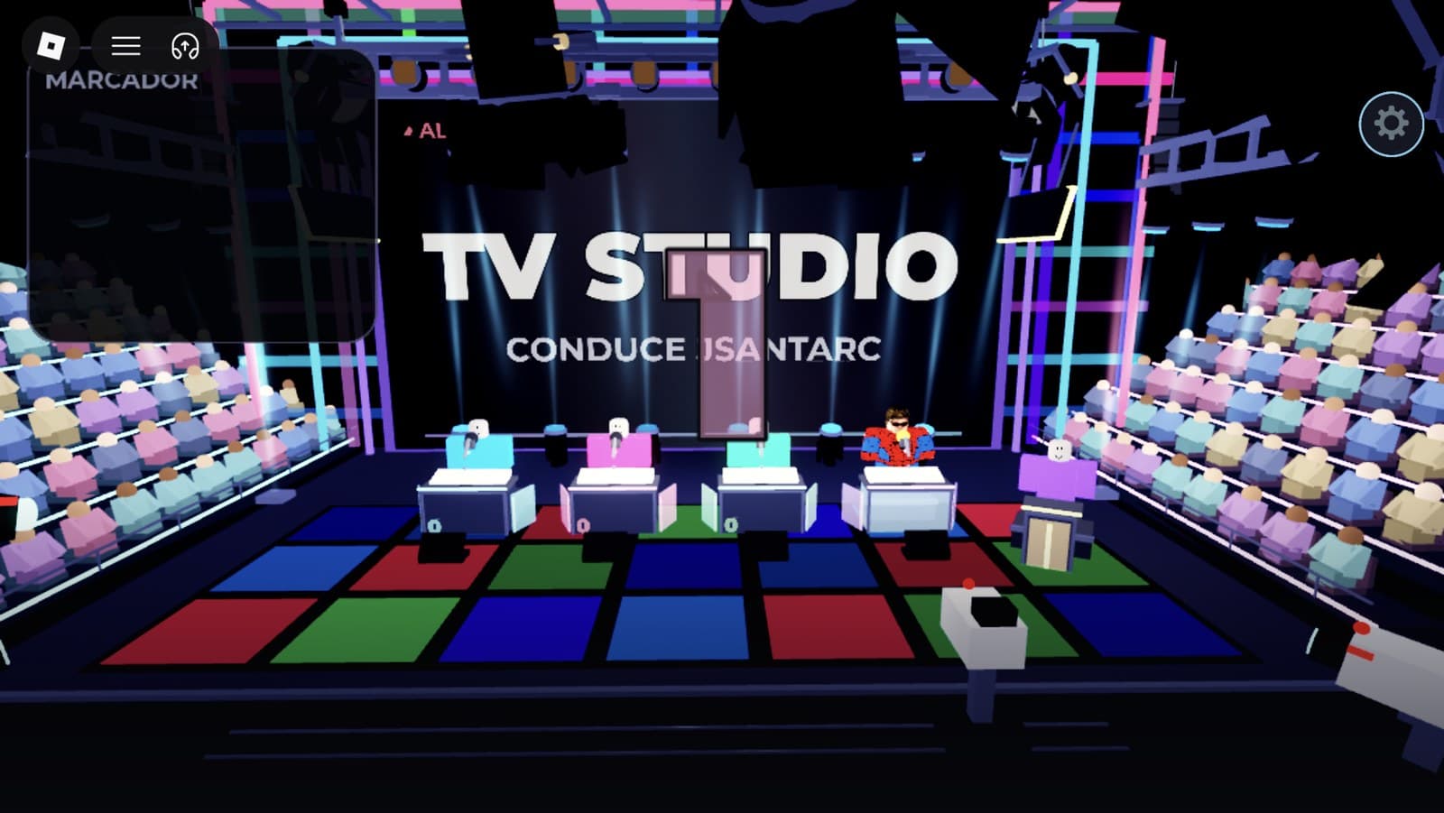 Crane shot over the studio set with the video wall reading TV Studio, hosted by jsantarc